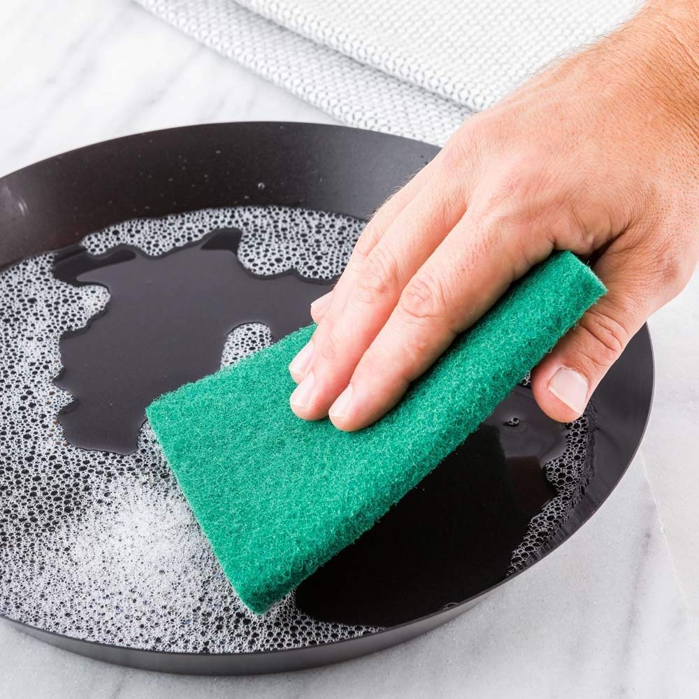High-quality scrub sponges in aqua green, pack of 6 for household tasks. High-quality scrub sponges in aqua green, pack of 6 for household tasks.